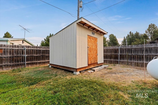 view of shed featuring a fenced backyard