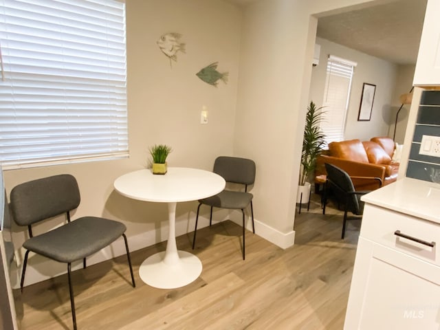 1101 Clithero Dr, Boise, ID 83703 - dining space with light wood-style flooring and baseboards
