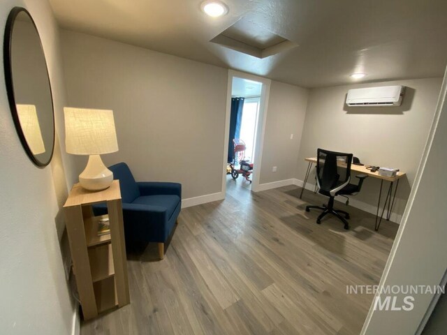 1101 Clithero Dr, Boise, ID 83703 - office featuring wood finished floors, a wall mounted air conditioner, and baseboards