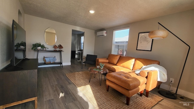 1101 Clithero Dr, Boise, ID 83703 - living room with baseboards, recessed lighting, a textured ceiling, a wall unit AC, and wood finished floors