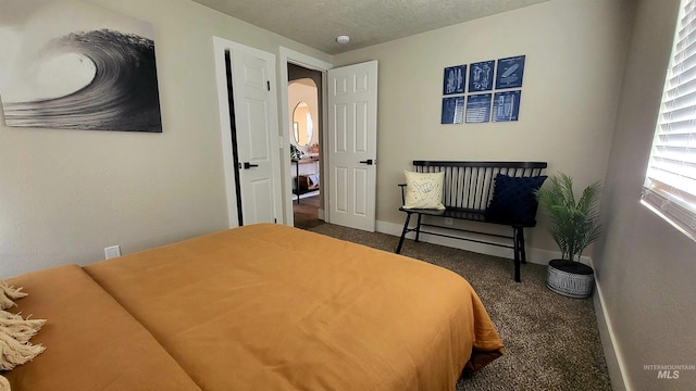 1101 Clithero Dr, Boise, ID 83703 - carpeted bedroom with baseboards, arched walkways, and a textured ceiling