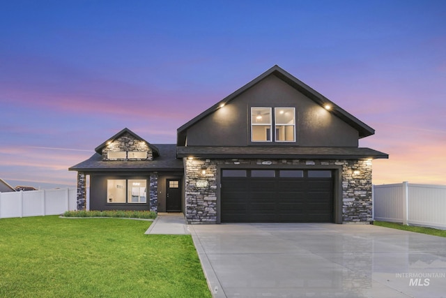 507 Jesse Ave, Twin Falls, ID 83301 - view of front of property with stone siding, driveway, and an attached garage