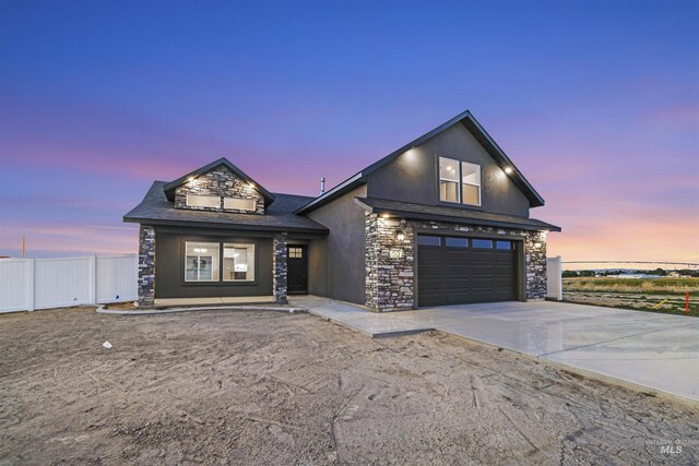 507 Jesse Ave, Twin Falls, ID 83301 - modern farmhouse style home with stone siding, concrete driveway, stucco siding, and an attached garage