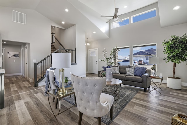 507 Jesse Ave, Twin Falls, ID 83301 - living area featuring a towering ceiling, ceiling fan, stairway, wood finished floors, and baseboards