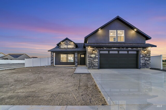 507 Jesse Ave, Twin Falls, ID 83301 - view of front of property with stone siding, driveway, and an attached garage