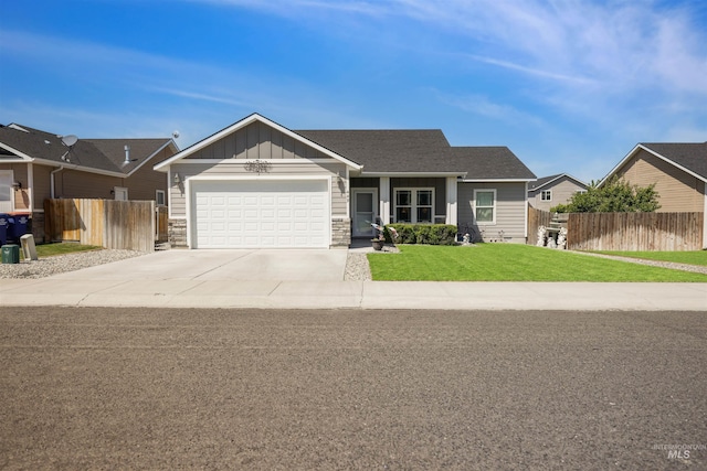 449 View Ave, Twin Falls, ID 83301 - view of front of home with a garage, driveway, board and batten siding, and stone siding