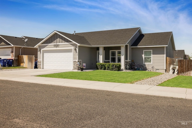 449 View Ave, Twin Falls, ID 83301 - view of front facade with a garage, board and batten siding, concrete driveway, and a shingled roof
