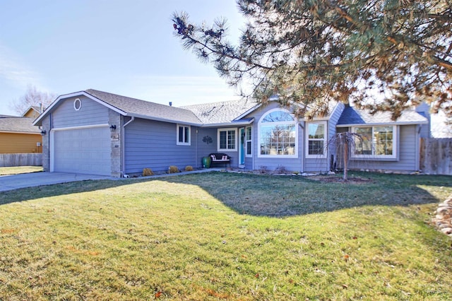 single story home with a garage and a front lawn