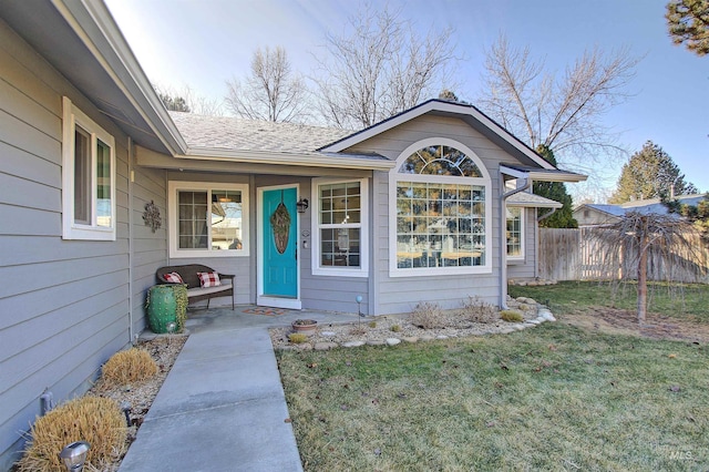 doorway to property with a yard