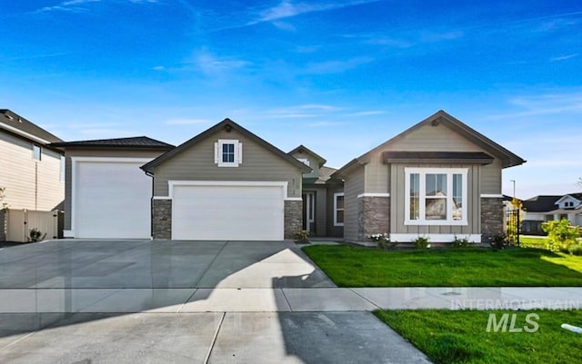 view of front of home with a garage and a front yard