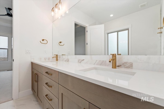 full bathroom with visible vents, a sink, and double vanity