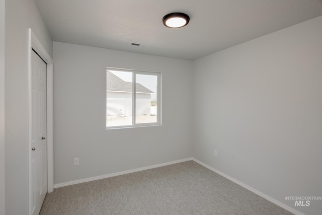 unfurnished bedroom with carpet floors and a closet