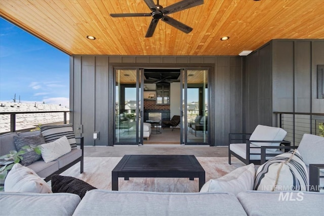 view of patio with an outdoor hangout area and a ceiling fan