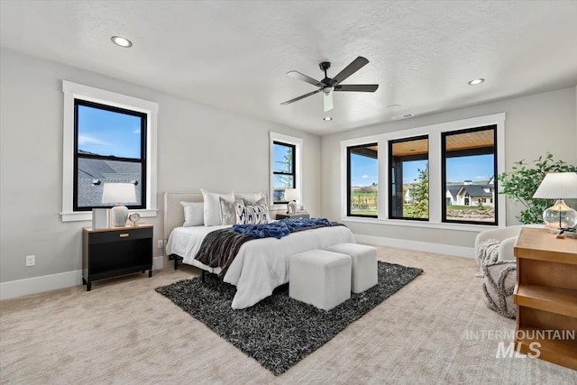 bedroom with recessed lighting, visible vents, carpet flooring, and baseboards