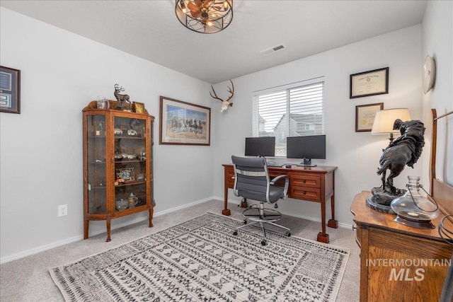 home office with carpet flooring and baseboards