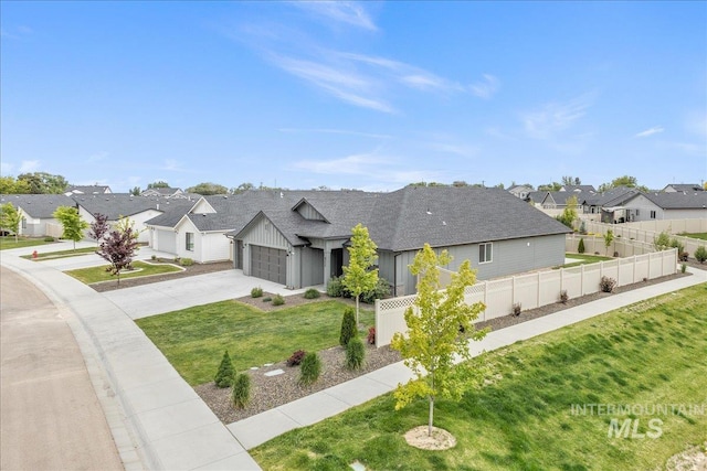 modern farmhouse with a residential view, board and batten siding, driveway, and an attached garage