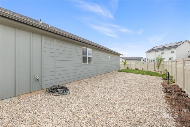 view of home's exterior featuring a fenced backyard and board and batten siding