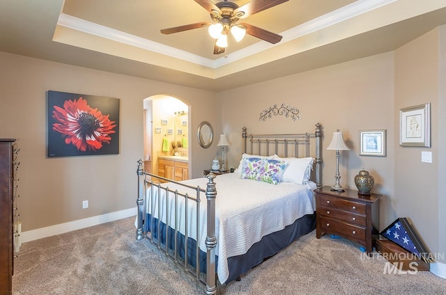 1719 E Horse Creek Ct, Meridian, ID 83642 - bedroom with carpet floors, a tray ceiling, arched walkways, ornamental molding, and baseboards