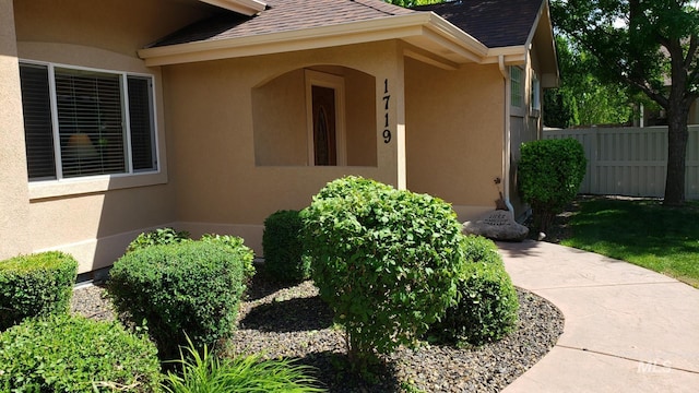 1719 E Horse Creek Ct, Meridian, ID 83642 - property entrance featuring a shingled roof and stucco siding