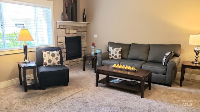 1719 E Horse Creek Ct, Meridian, ID 83642 - living room featuring carpet, a stone fireplace, and baseboards