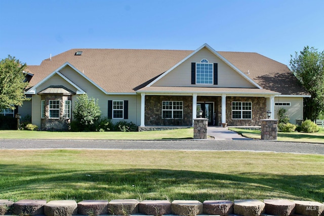3703 E 3793 N, Kimberly, ID 83341 - view of front of house with a front yard, stone siding, and covered porch