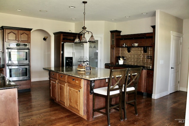 3703 E 3793 N, Kimberly, ID 83341 - kitchen featuring stainless steel appliances, open shelves, dark wood-type flooring, backsplash, and recessed lighting