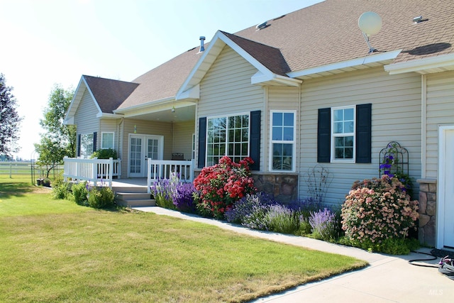 3703 E 3793 N, Kimberly, ID 83341 - back of house featuring a lawn, a shingled roof, stone siding, and french doors