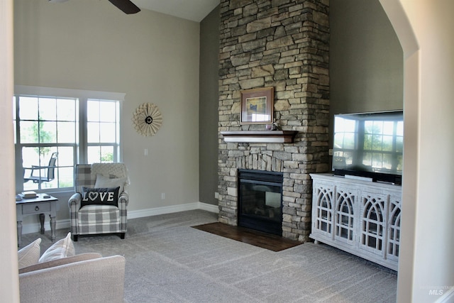 3703 E 3793 N, Kimberly, ID 83341 - carpeted living room with a ceiling fan, a fireplace, high vaulted ceiling, and arched walkways