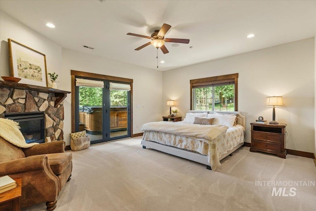 3801 S Carpenter Loop, Post Falls, ID 83854 - bedroom with visible vents, access to exterior, multiple windows, and light carpet