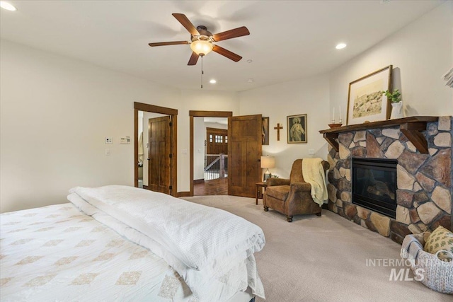 3801 S Carpenter Loop, Post Falls, ID 83854 - bedroom featuring carpet floors, recessed lighting, a ceiling fan, and a fireplace