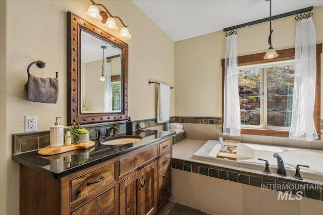 3801 S Carpenter Loop, Post Falls, ID 83854 - bathroom with vanity, lofted ceiling, and a bath