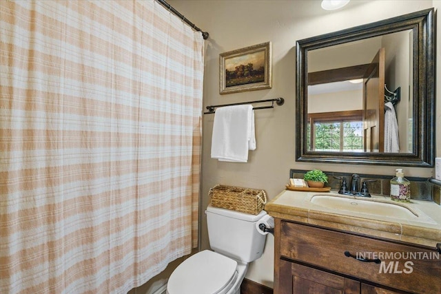 3801 S Carpenter Loop, Post Falls, ID 83854 - bathroom with toilet, a shower with curtain, and vanity