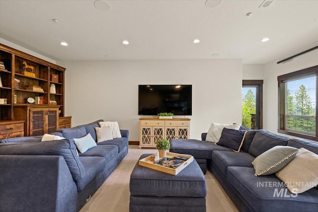 3801 S Carpenter Loop, Post Falls, ID 83854 - living room featuring recessed lighting and light colored carpet