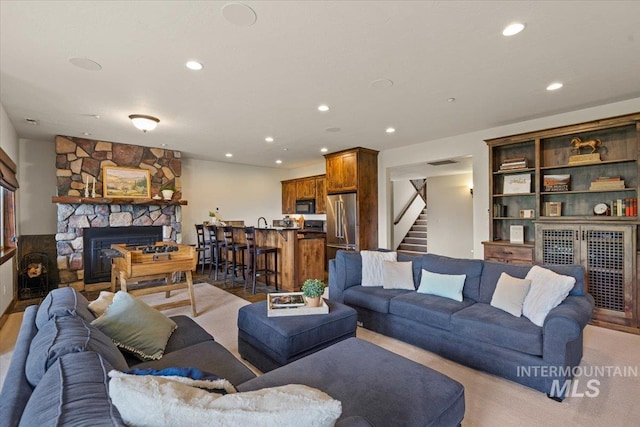 3801 S Carpenter Loop, Post Falls, ID 83854 - living area featuring a fireplace, recessed lighting, and stairs