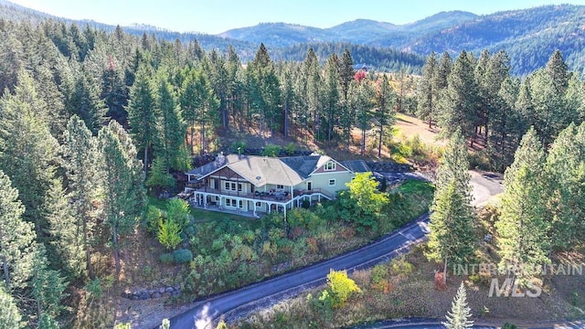 3801 S Carpenter Loop, Post Falls, ID 83854 - drone / aerial view featuring a view of trees and a mountain view