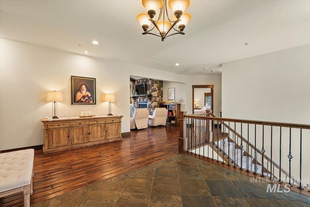 3801 S Carpenter Loop, Post Falls, ID 83854 - corridor featuring recessed lighting, an inviting chandelier, an upstairs landing, and dark wood-type flooring