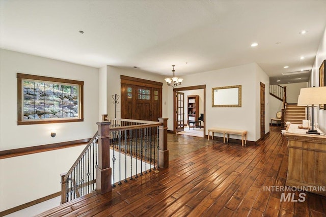 3801 S Carpenter Loop, Post Falls, ID 83854 - foyer with an inviting chandelier, recessed lighting, baseboards, a healthy amount of sunlight, and dark wood-style floors