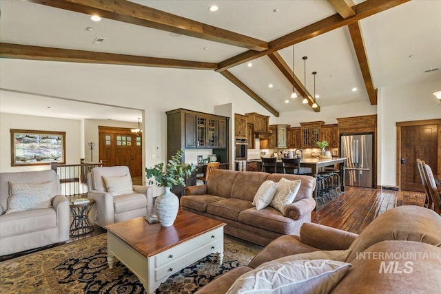 3801 S Carpenter Loop, Post Falls, ID 83854 - living room featuring recessed lighting, dark wood finished floors, beam ceiling, and high vaulted ceiling