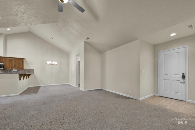 2870 N Cloverdale, Boise, ID 83713 - unfurnished living room featuring a ceiling fan, light colored carpet, a chandelier, vaulted ceiling, and recessed lighting