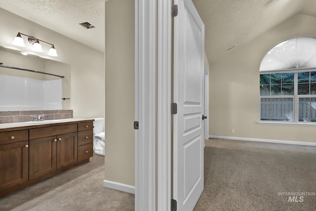 2870 N Cloverdale, Boise, ID 83713 - full bathroom featuring vanity, a shower, a textured ceiling, lofted ceiling, and decorative backsplash
