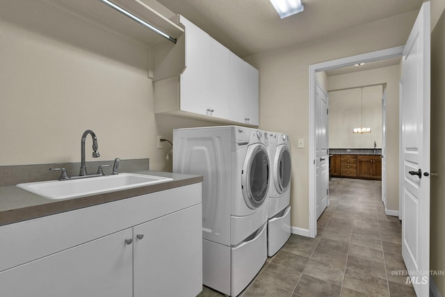 2870 N Cloverdale, Boise, ID 83713 - washroom featuring washer and dryer and cabinet space