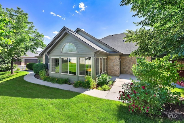 2870 N Cloverdale, Boise, ID 83713 - back of property with a lawn, a shingled roof, and stone siding