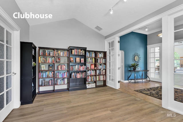 2870 N Cloverdale, Boise, ID 83713 - sitting room featuring french doors, lofted ceiling, and wood finished floors