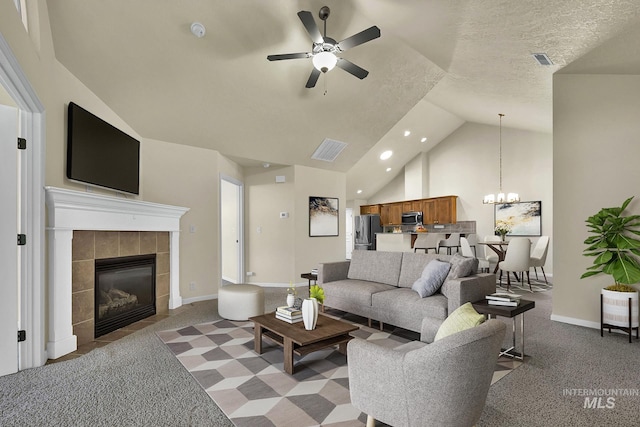 2870 N Cloverdale, Boise, ID 83713 - carpeted living area featuring a ceiling fan, lofted ceiling, a chandelier, recessed lighting, and a tile fireplace