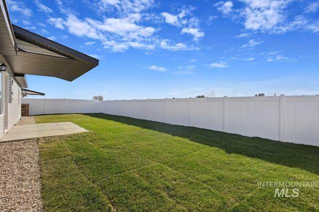 view of yard with a fenced backyard