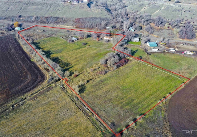 birds eye view of property featuring a rural view