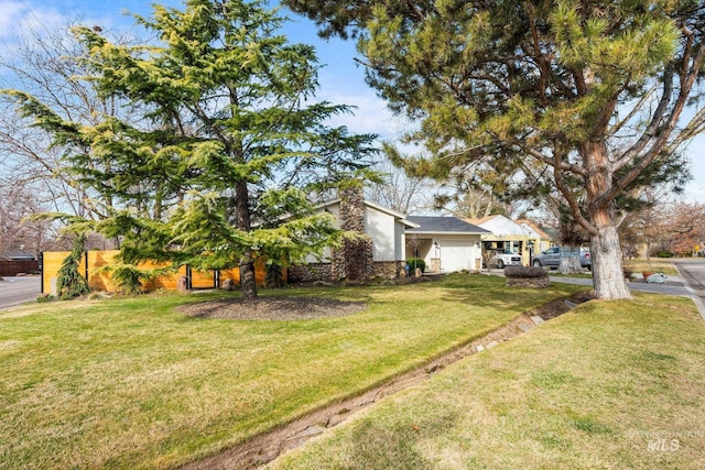 view of yard featuring an attached garage