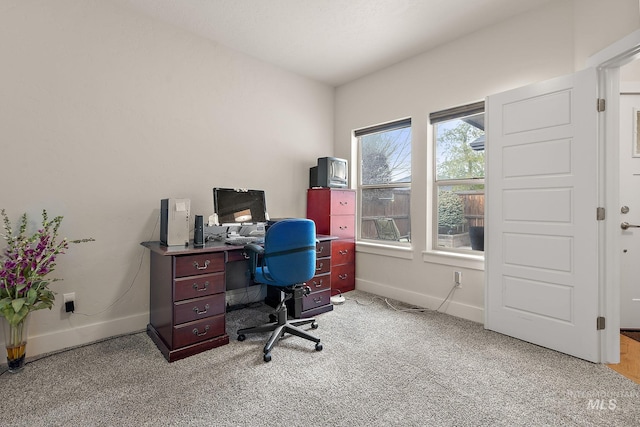 office space with carpet and baseboards