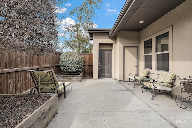 view of patio / terrace with fence