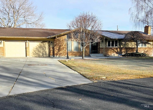 ranch-style house featuring a garage